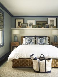 Blue walls, gallery wall, bohemian accent pillows, luxury interior, bedroom design, modern elements, transitional design