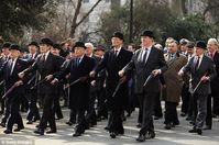smartly dressed members of the prestigious In & Out Club for a parade to mark the 150th anniversary of the club's founding.