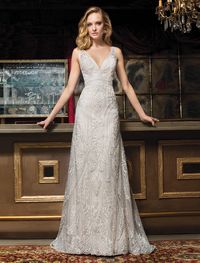 Cosmobella Collection - Wedding Dress Style 7970 : Luxurious, embossed lace embellishes this striking A-line gown with V-neckline, low back with sheer accents and Sweep train. Shown: Ivory/Nude