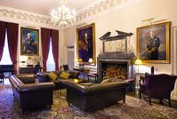 in and out club naval military club st james london interior shot of Hogarth picture lights. Lounge