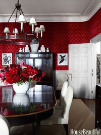 Bold Red Dining Room - Walls covered in Lee Jofa's Holland Flamestitch velvet make for a showstopping yet intimate dining room in a London townhouse.