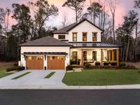 The beautiful front yard of HGTV Smart Home 2022 in Wilmington, North Carolina offers a preview of this sophisticated and timeless waterside retreat.