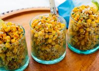 This esquites recipe is easy to make and yields amazing results! Esquites are Mexican street corn, served as salad. Also known as elote en vaso, esquites are typically served in little cups. Serve esquites as a snack or party appetizer! #esquites #mexican #corn #summersalad #cookieandkate