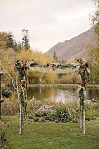 How pretty would this rustic arch be for an outside wedding !