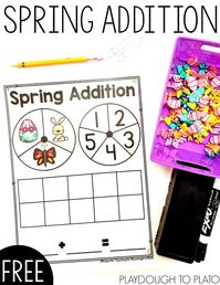 Dive into your stash of mini erasers or use our printable cut outs for a playful spring addition game that gives kids practice writing and solving addition equations. It's a perfect math center for kindergarten! #springmathcenters #additionactivities