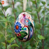 Easter eggs with bird, made of wood and hand painted in Ukraine