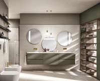 Mineral Green matt lacquered vanity units. 1.2 cm thick Glacier White Corian top with Spring built-in washbasin. “Fluida” Wall System in Garden Walnut Decorative Melamine.