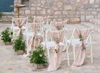 Tie blush-colored fabric to your guest chairs to add a splash of color