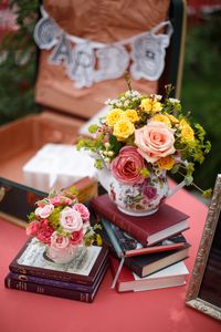 Books and tea pots. Flowers and Decor: La Petite Fleur Weddings and Events. Photography: Gene Smirnov - smirnovweddings.com/