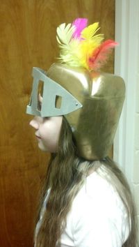 Helmets made of gallon milk jugs. Spray paint gold, add visor with small brads and hot glue a few feathers on top. They looked awesome!