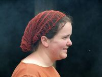 Reenactor with a sprang cap at the open air museum Eindhoven. Photo by Ruud von Oers.