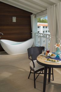 Enjoy a large tranquility soaking tub with your room at Sandals Barbados. Experience a whole new way to celebrate romance al fresco. | Sandals Resorts | Romantic Vacation | Couples Only
