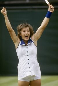 All buttoned up, and wearing pinstripes more suitable for a Yankee, Martina Navratilova celebrates after winning Wimbledonin 1978.