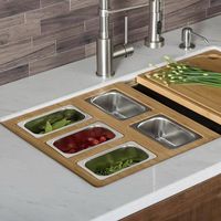 Transform your KRAUS Workstation Sink into the ultimate prep and entertainment space with a custom-fit serving board that slides across the integrated ledge. 100% organic bamboo serving board holds stainless steel bowls that are perfect for prepping ingredients or serving up snacks and condiments. The streamlined design simplifies your kitchen workflow by keeping ingredients right at your fingertips, and creates an effortless transition from prepping to serving. Best of all, working right over t