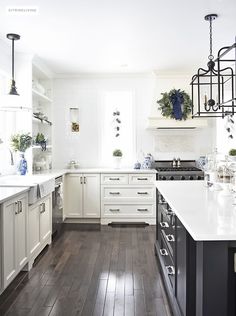 a beautiful christmas kitchen with blue and white chinoiserie paired with holiday greenery for a
