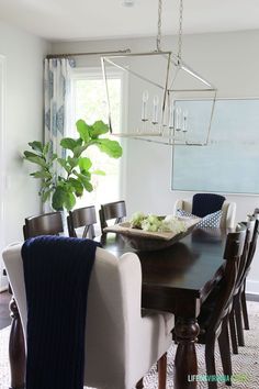 darlana linear chandelier. the chandelier hanging over the table darlana linear chandelier. the chandelier hanging over the table