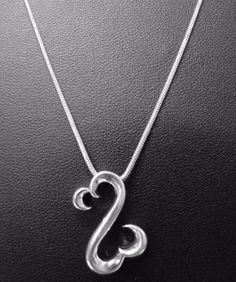18-Inch Rhodium Plated Necklace with 4mm Amethyst Birthstone Beads and Sterling Silver Saint Dorothy Charm.