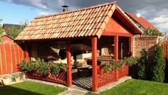 Compact outdoor kitchen with pizza oven and traditional stove ...