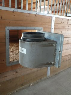 Swing out doors with insulated bucket holders—my one "splurge" when we built the barn. Keeps water from freezing in winter!