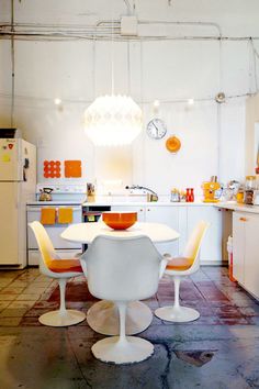 Multi Coloured Clear And Chairs Another Version Of The Kelly Reemtsen Downtown Artist Loft Los Angeles Saarinen Orange Tulip Table