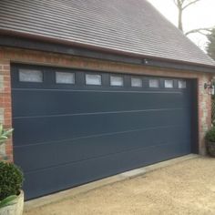 sectional garage doors wood effect anthracite grey flush smooth sectional garage door with windows glazing automated and insulated the 17 best doors images on pinterest sectional garage doors wood effect anthracite grey flush smooth sectional garage door with windows glazing automated and insulated the 17 best doors images on pinterest