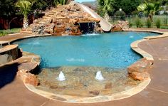 Backyard Pool Designs With Slides swimming pool with beach entry and grotto. love that it has a Backyard Pool Designs With Slides swimming pool with beach entry and grotto. love that it has a