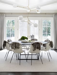 409 Best Dining Room Images On Pinterest Lunch Chairs And Stunning Scandinavian Dining Room With Large Round Table White Chairs Faux Fur Hung Over The French Doors And Abstract Lighting Tamara