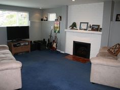 bedroom with gray whiles and bright blue carpet home decor