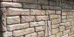 Poured concrete retaining walls can be colored and stamped to look like natural stone