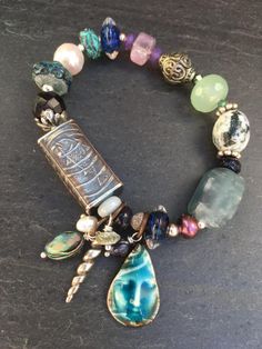 Designer exclusive unique jewelry. Beryl AAA beads elastic bracelet with silk tassel and heart matte bead