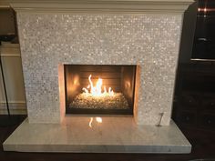 Enhance Your Fireplace Surround with Mother of Pearl Tiles | home remodel | Pinterest | Fireplace surrounds Pearls and Living rooms