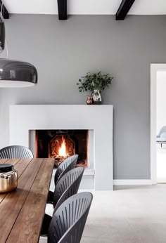 Kaja Møller, head of Danish furniture brand Fredericia, opted for a Scandi-inspired colour palette of greys, whites and taupes for the interiors of her family home in Copenhagen. Grey Fireplace, Home Fireplace, Fireplace Design, Modern Fireplace, Minimal Fireplace, Modern Houses Interior, Contemporary Interior Design, Interior Design Kitchen, Design Bathroom