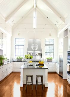 White Kitchen Vaulted Ceiling wood beams and painted beadboard emphasize the vaulting of the White Kitchen Vaulted Ceiling wood beams and painted beadboard emphasize the vaulting of the