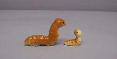 Retired Hagen Renaker Orange Caterpillar Pair with Green Spots