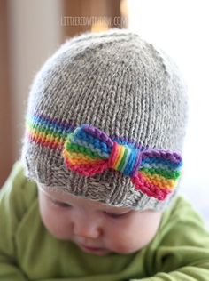 Knit your little one a sweet RainBOW baby hat including rainbow band and bow with this adorable knitting pattern!