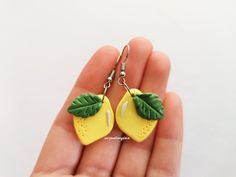 round danging earrings in polymer clay and tropical leaf motifs Fimo blue grey jungle spirit