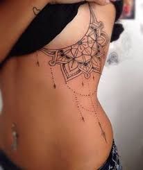 rib tattoos under breast