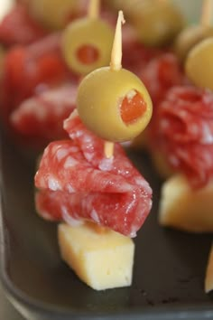 pitted green olive, stuffed with marinated red pepper, and skewered with a piece of salami, and some cheese Foods, Canapés, Canapes, Comidas, Mesa, Meze