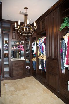 featuring crown dental molding and a concealed laundry hamper this white melamine walk in was born from a harmonious coll walk in closet organizers - Custom Closet Organizers featuring crown dental molding and a concealed laundry hamper this white melamine walk in was born from a harmonious coll walk in closet organizers - Custom Closet Organizers