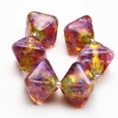lots of colours Handmade Borosilicate 22k Gold fumed purple Hand faceted Beads 3 sizes