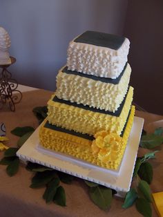 Four Tier Square Wedding Cake With Cream To Gold Ombre Ruffles Charcoal Tops And A Four Tier Square Wedding Cake With Cream To Gold Ombre Ruffles Charcoal Tops And A