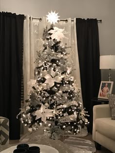 black christmas tree with silver and white decorations decorated by donna munoz - Black And Gold Christmas Tree black christmas tree with silver and white decorations decorated by donna munoz - Black And Gold Christmas Tree