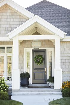 136 Best Front Door Images In 2019 Entry Doors Entrance Suzanne Kasler Morris Lantern Ed Above A Black Front Door In Covered Porch With Border Doormat And Styled Potted Plants