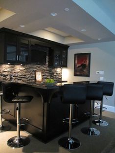 Bars For Basements sleek basement bar features black cabinets paired with gray Bars For Basements sleek basement bar features black cabinets paired with gray