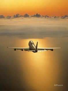 Airplane Flying Through Clouds Photographic Print by Peter Walton at AllPosters.com
