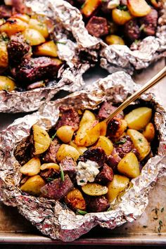 Garlic Butter Steak and Potato Foil Packets are the quintessential family cookout meal that will be loved by all. Loaded with juicy pieces of steak, tender baby potatoes, all topped off with flavorful melted herb garlic butter. #thefoodcafe #foilpacket #familydinner #grilling #summerfood #steak #potatoes