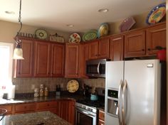 Like The Decor On Top Of Cabinets Kitchen Pinterest Kitchens Top Of Cabinet Decorating Ideas
