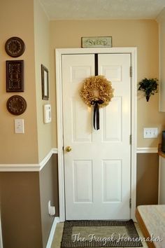 two tone dining room with chair rail light color above dark color