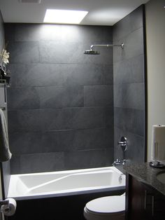 I like this shower! Gray tile, tiny subway tiles, built-in shelves ... I like this shower! Gray tile, tiny subway tiles, built-in shelves ...