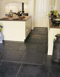 Cream colored island... dark wood counters Note sure if slate floors are making a comeback, but it reminds me of home. I think a splash of light robin blue and black trim might excite this a little. Home, Layout, Design, Home Décor, Interior, Slate Floor Kitchen, Kitchen Floor, Slate Kitchen